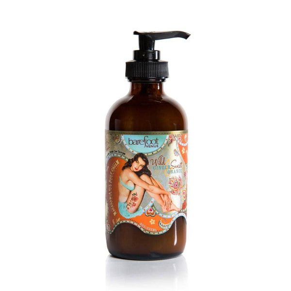 Brown lotion bottle with a colorful label featuring a pin-up style model on a white background