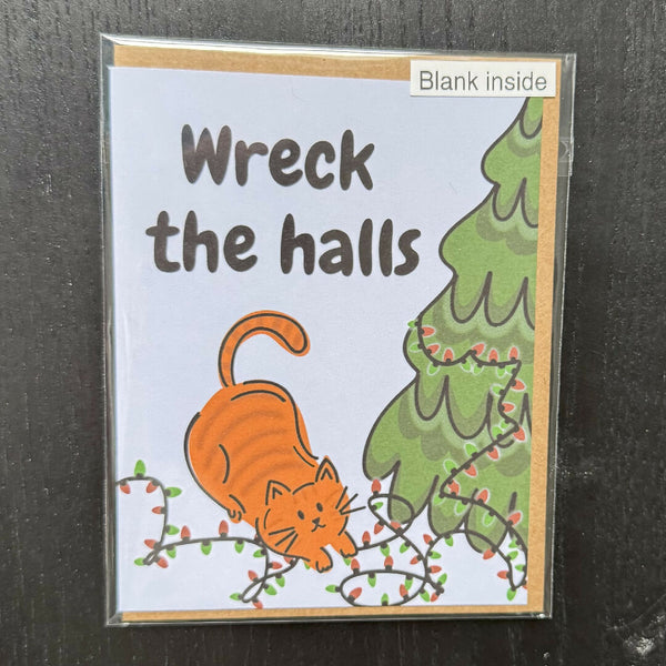 Carte de vœux de Noël avec un chat qui déchire tout
