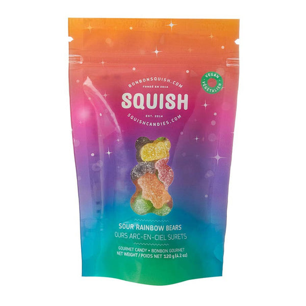 A colorful package of Squish Vegan Sour Rainbow Bears candy. The package is predominantly orange with a background image of a rainbow and a visible sour bear candy in one of the rainbow colors.