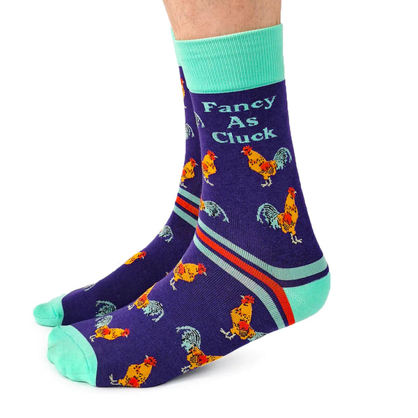 A pair of colorful socks with chicken patterns and the text 'Fancy As Cluck' displayed on the side.