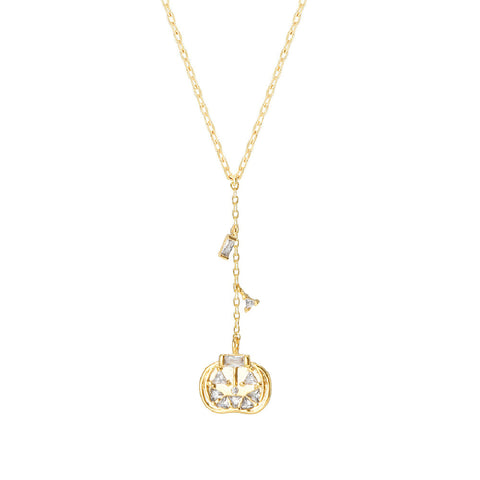 Gold necklace with a pumpkin jack-o-lantern on a white background
